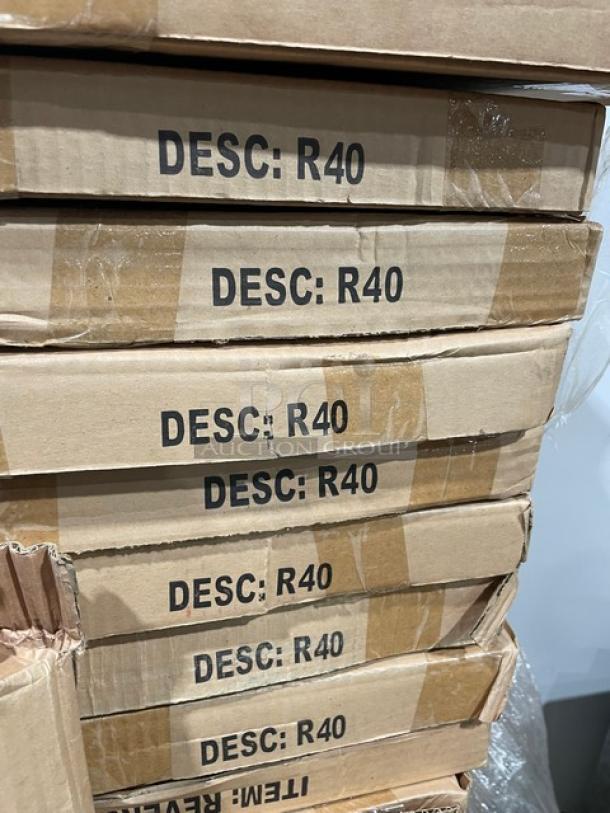 Boxes of brand new Model R40 bar-height dining tables, 40-inch round, laminate, reversible mahogany/black.