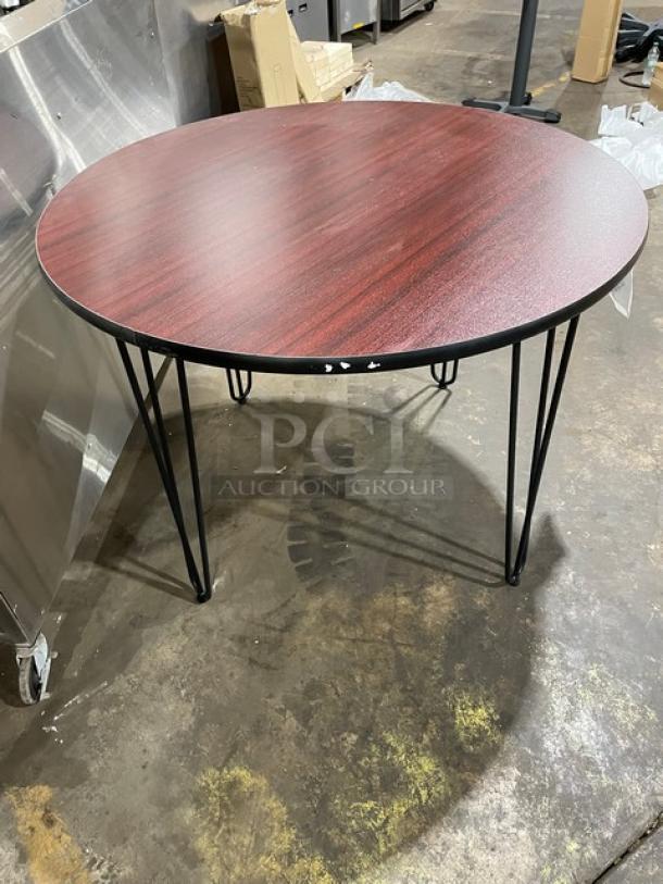 Brand new 40-inch round reversible mahogany/black laminate bar-height table, model R40, with metal legs.