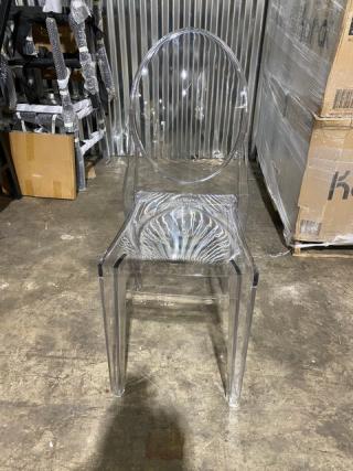 Brand new Flash Ghost clear heavy-duty stackable dining chair, poly material, modern design, pristine condition.