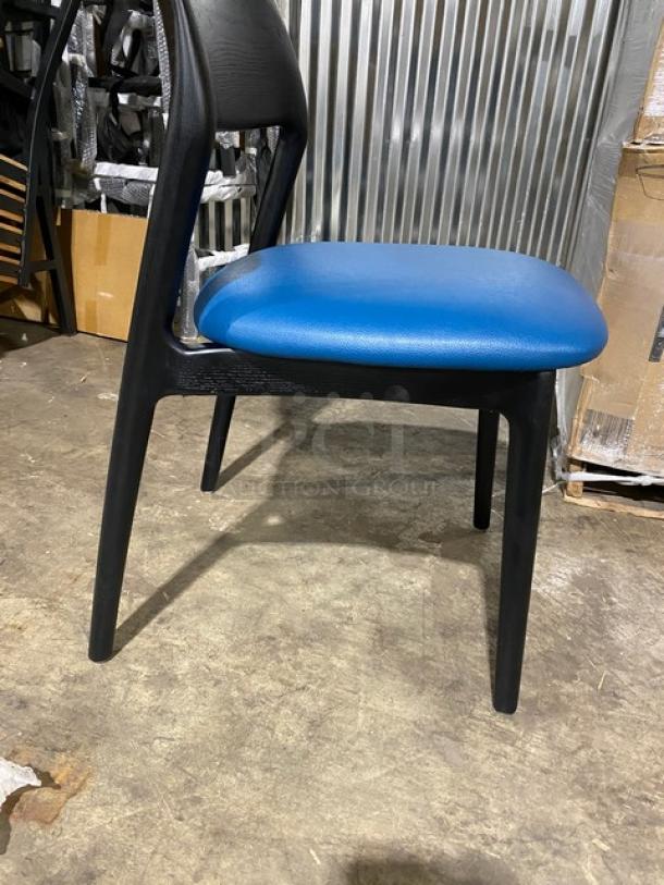 Black poly frame dining chair with blue cushioned seat, suitable for indoor/outdoor use, brand new condition.