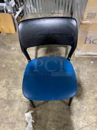 Brand new black poly frame dining chair with blue cushioned seat, durable for indoor/outdoor use, heavy duty build.