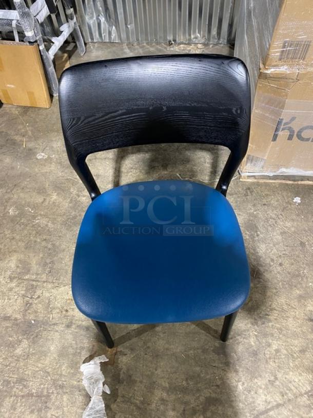 Black poly frame dining chair with blue cushioned seat, brand new, suitable for indoor/outdoor use.