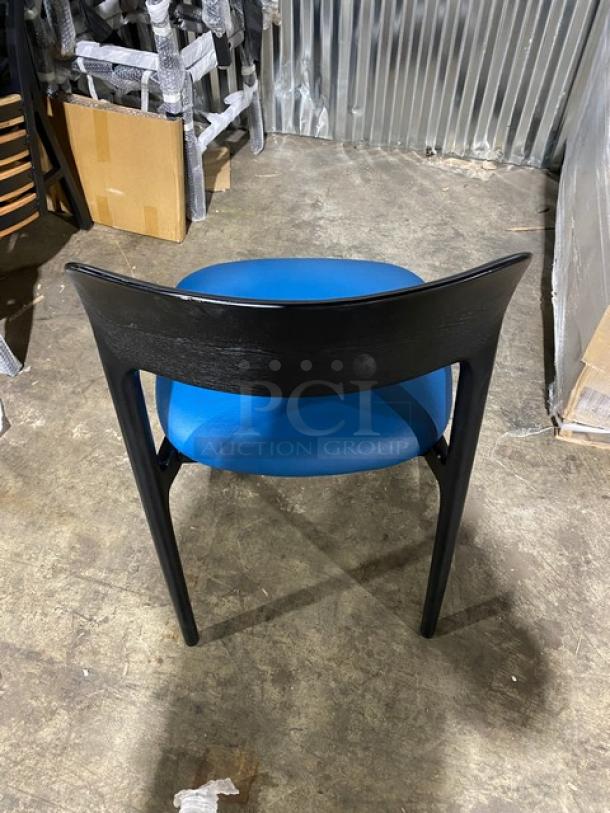 Black poly frame dining chair with a blue cushioned seat. New condition. Suitable for indoor/outdoor use.