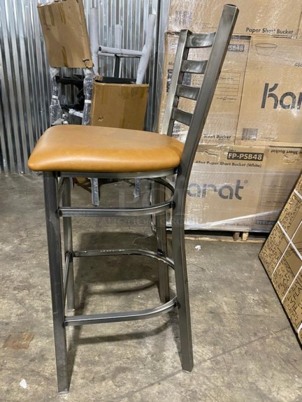 Dante Model 513 metal ladder-back bar chair, new condition, distressed metal frame, cognac seat.