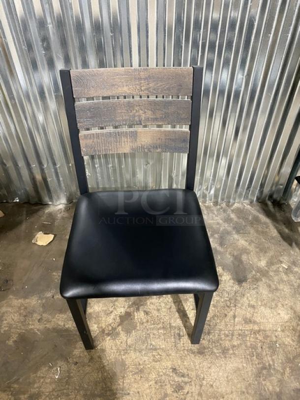 Brand new heavy-duty welded black metal slotted ladder back dining chair with cognac seat.