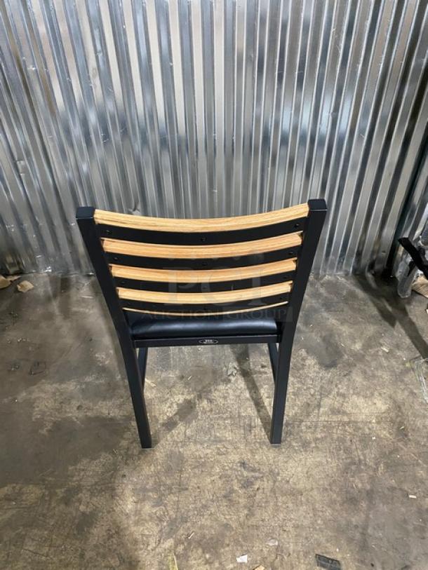 Brand new heavy-duty black metal dining chair, wooden slotted ladder back, black seat, part of set of four.