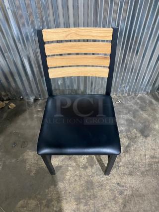 Brand new heavy-duty black metal dining chair with wooden slotted ladder back and black seat, sold as a set of four.