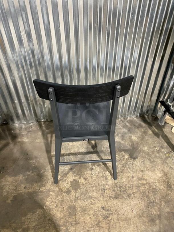 Kinley 570 dining chair, black metal frame, distressed black wooden seat and back, brand new condition.