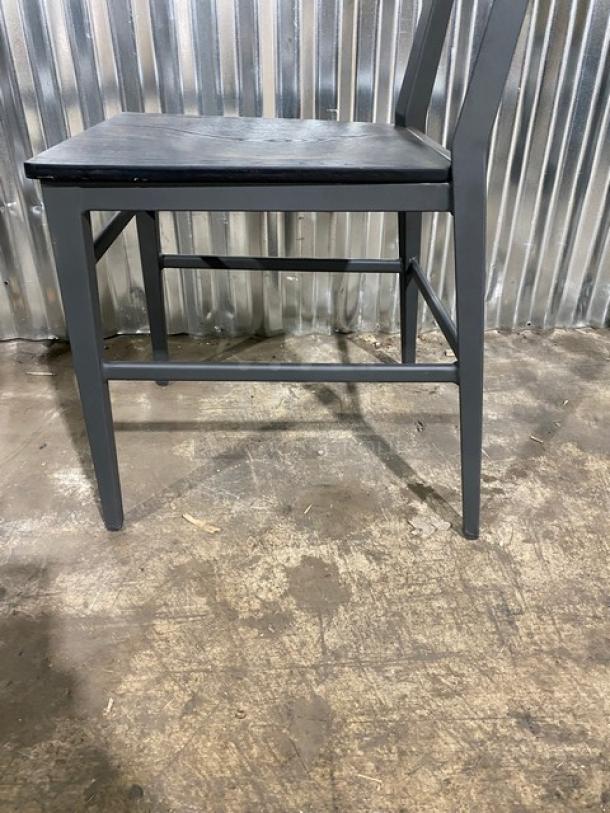 Kinley Model 570 dining chair, black metal frame, distressed black wooden seat/back, brand new condition.