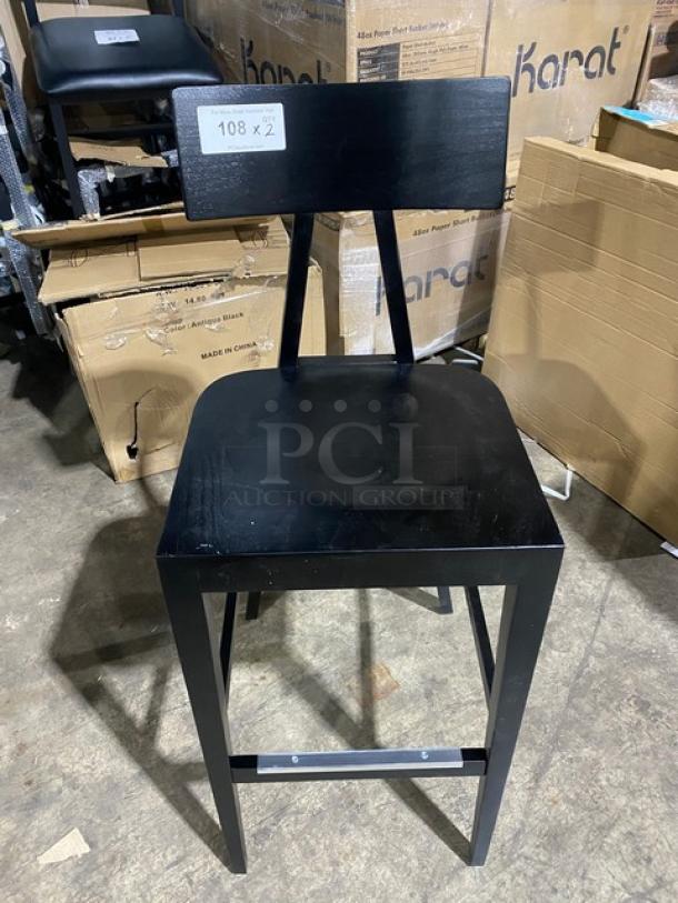 Brand new Toledo bar-height black bar stool with a sleek design. Includes a tag indicating "108 x 2" for auction details.