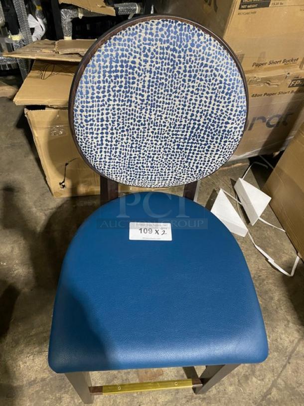 Brand new solid wood-style bar stool with blue upholstered seat and patterned round backrest, labeled "109 x ½."
