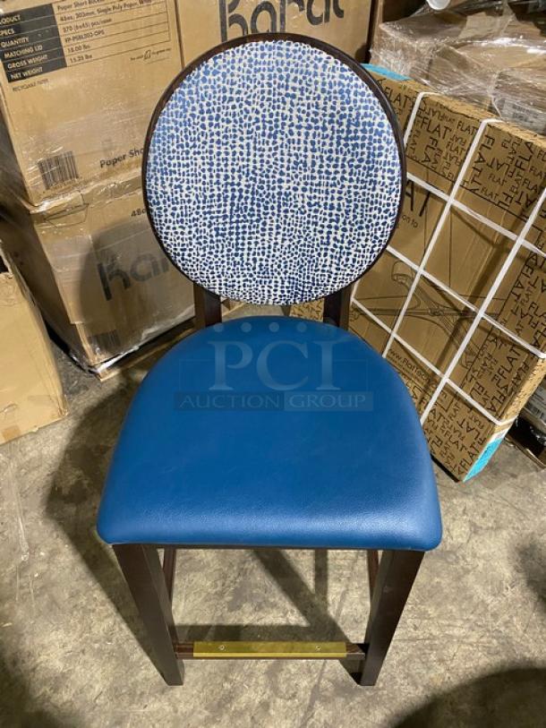 Brand new round-back bar stool with solid wood-style frame, blue upholstered seat, and printed backrest.