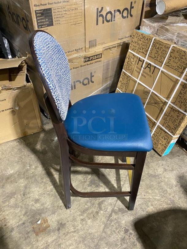 Brand new solid wood-style round-back bar stool with blue upholstered seat, patterned backrest, and sturdy construction.