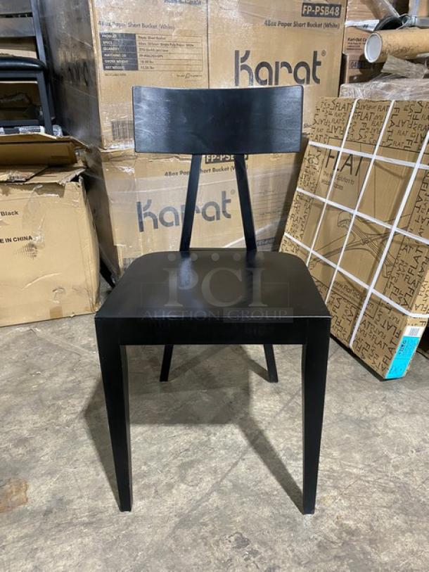 Brand new Toledo bar-height black bar stool, sleek design, unblemished finish, in warehouse setting.