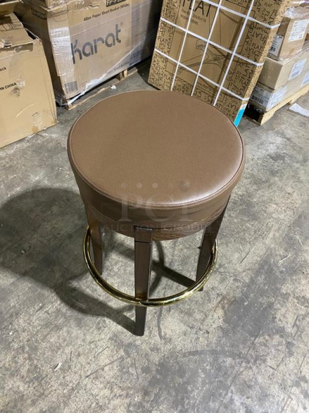 Brand new mid-century modern style round swivel bar stool with brass finish and tan upholstered seat, excellent condition.