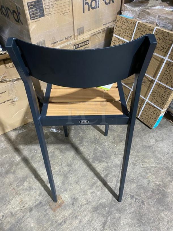 Brand new black aluminum outdoor bar-height stool with light brown imitation teak slat seat, durable construction.