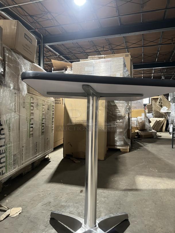 Commercial black modern square dining table with stainless steel pedestal base, suitable for indoor/outdoor use.