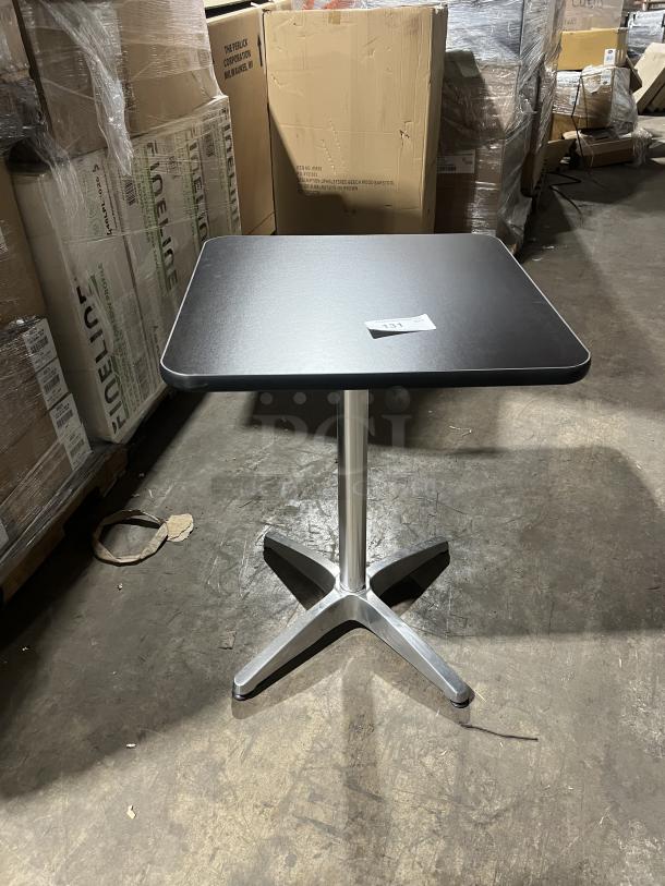 Commercial black square dining table with stainless steel pedestal base, modern style, suitable for indoor/outdoor use.