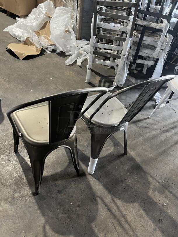 Tolix-style industrial metal stackable dining chairs, gray finish, new condition, suitable for commercial use, perforated seats.