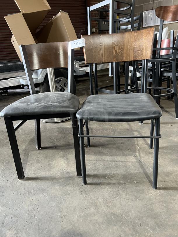 Commercial black padded stackable dining chair with curved wood backrest and metal frame. Good condition.