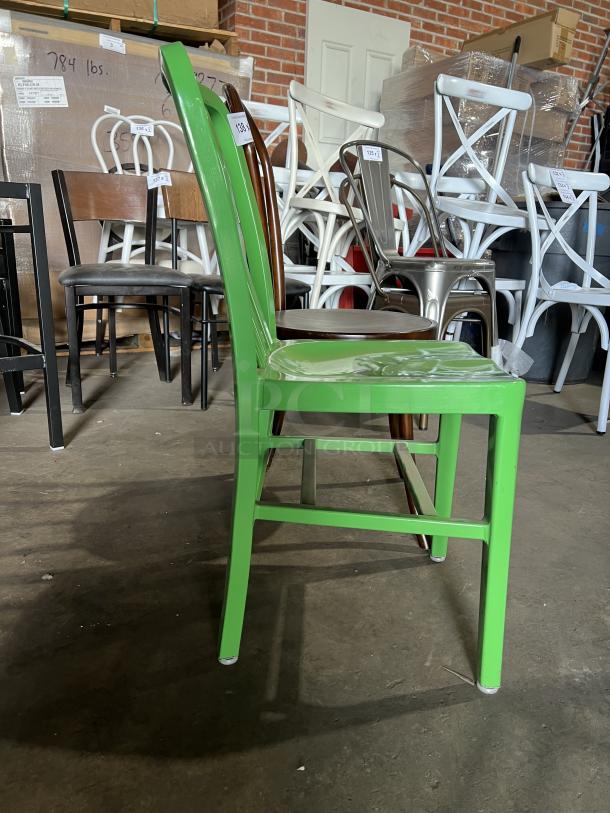 Flash Furniture green metal stackable chair, in good condition, paired with brown bentwood style dining chair.
