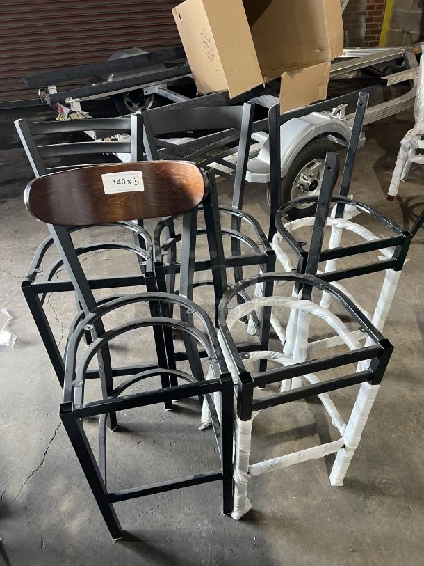 Brand new miscellaneous dining chairs, metal and wood construction, labeled "140 x 5", in storage area.