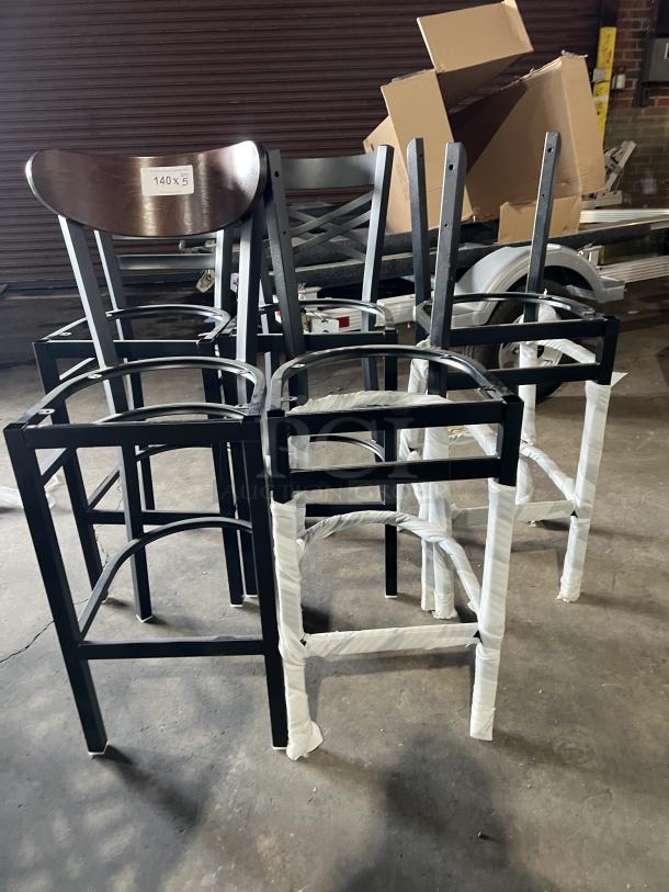 Brand new miscellaneous dining chairs, black metal frame, wood seats, protective wrapping, lot of five, label marked 140x3.