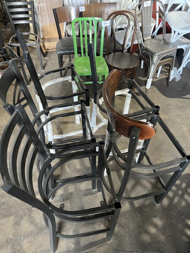 A collection of brand new miscellaneous dining chairs, various styles and colors, arranged in a storage area.