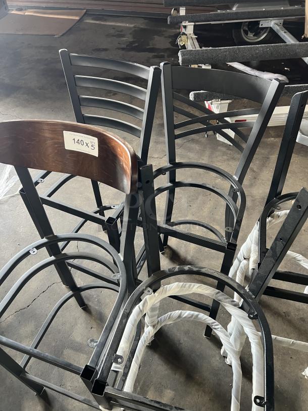 A lot of brand new miscellaneous dining chairs, metal and wood frames, five pieces tagged "140 X qty 5."