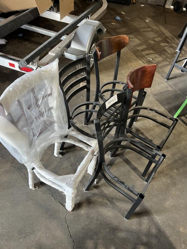 Brand new miscellaneous dining chairs, various styles, metal frames, some with wood accents, one wrapped in plastic.