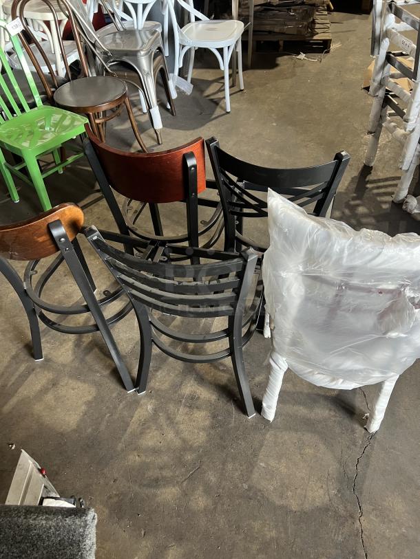 A variety of brand new dining chairs, various styles and colors, some wrapped in plastic, excellent condition.