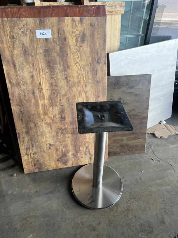 Stainless steel table base with wooden square and rectangular tabletops in various styles, labeled "142 x 5."