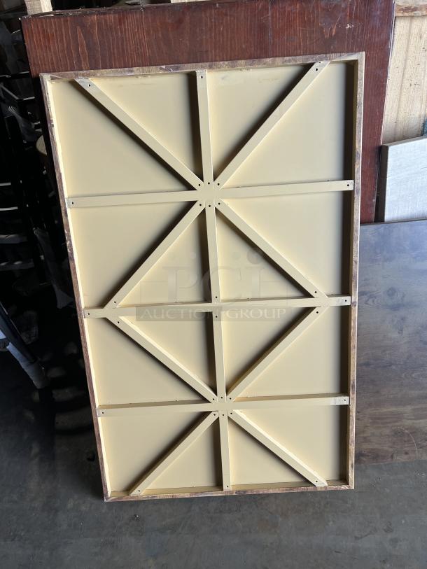 Stainless steel table base with wooden base and multiple style square and rectangular tabletops.