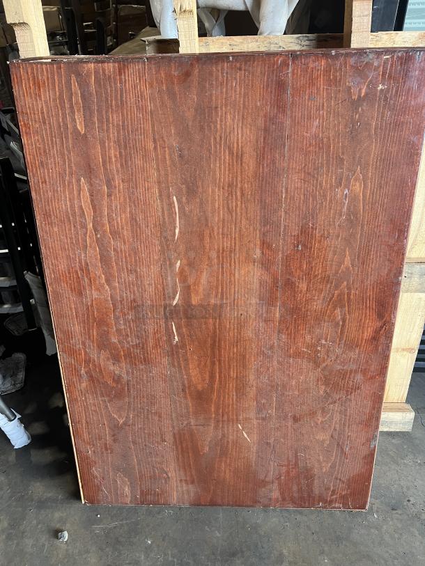 Wooden rectangular tabletop with visible wood grain. Slight wear and scratches, suitable for stainless steel table base.