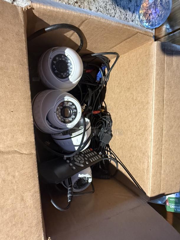 Complete SYRF04-KIT2 CCTV Security System in box; includes dome cameras and remote. Reliable, high-quality video, night vision.