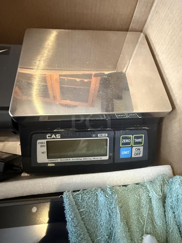 Pinnacle POS system with CAS SW-10 scale. Includes display with tare and unit buttons. Ideal for retail setups, reliable condition.