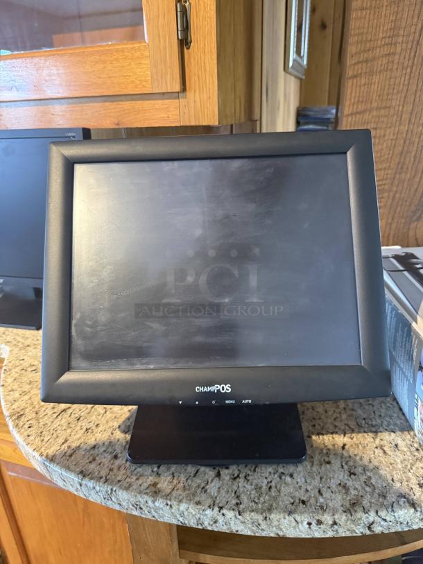 Pinnacle POS system with touchscreen monitor, labeled "CHAMP POS," in used condition. Ideal for retail and deli use.