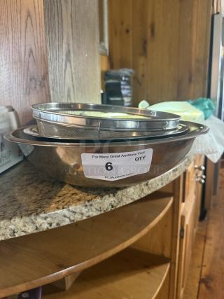 Commercial-grade 16" stainless steel mixing and sifting set on counter, includes bowls and mesh sifter, label with auction info.