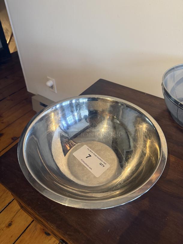 13" stainless steel mixing bowl, 13-quart capacity, commercial quality, shiny condition, auction tag reads "7, PCDAuctions.com".