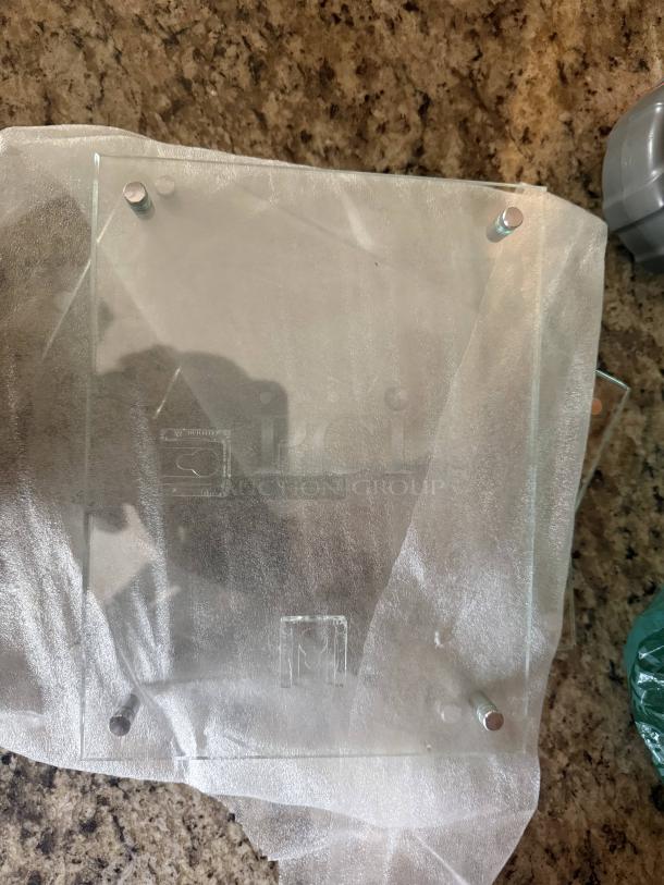 Lot of Lightwrite Erasable LED display frames, including clear acrylic and glass-style wall frames with standoff mounts.