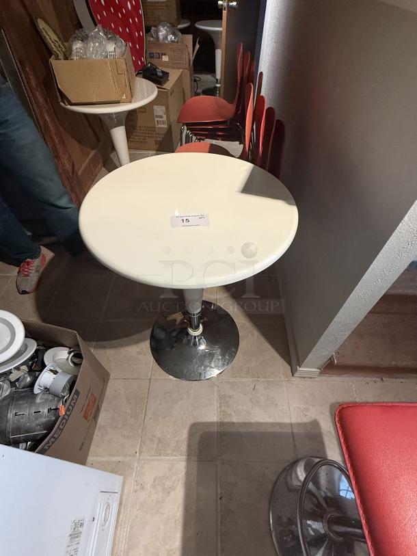 Set of 5 hydraulic adjustable bar tables with white tops and chrome bases. Features pneumatic lift. Modern, clean design.