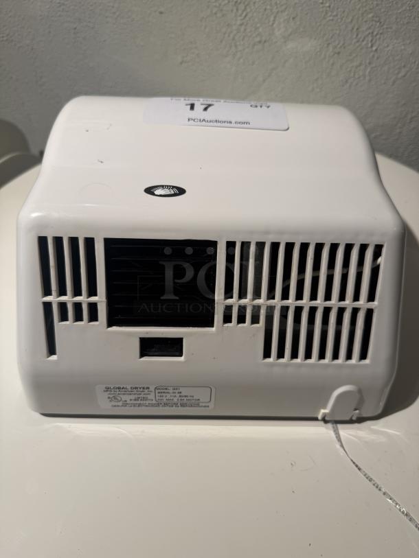 American Dryer GX1 hand dryer, white, automatic, compact, ideal for commercial use, minor wear, visible model label.