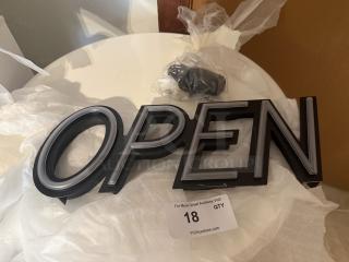 Modern LED "OPEN" sign with sleek design, black and gray lettering, in excellent condition. Includes original packaging and label.