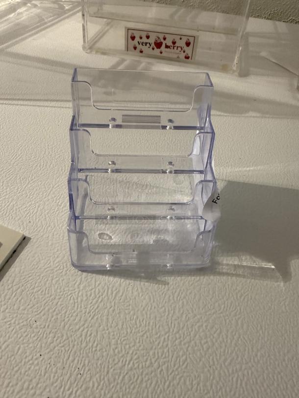 Clear 3-tier acrylic business card holder, perfect condition, displays multiple card stacks for desk or counter use.