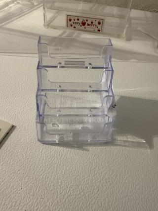 Clear 3-tier acrylic business card holder, perfect condition, displays multiple card stacks for desk or counter use.