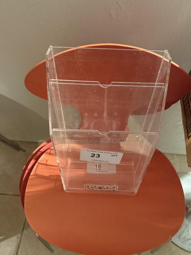 Clear acrylic 4-tier pamphlet holder, holds 4" x 9" brochures, each pocket fits 75 brochures. Quantity 23, sturdy design.