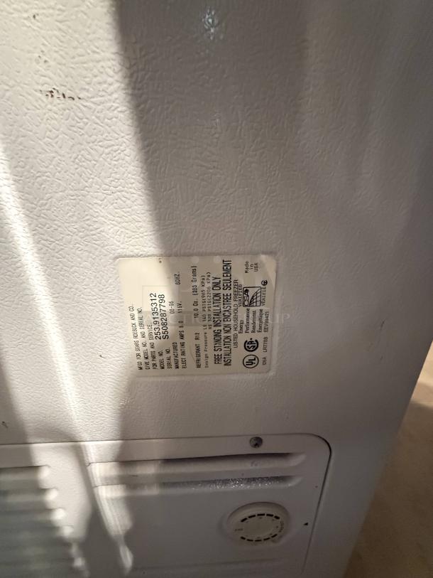 Kenmore Model 253.91935312 chest freezer label, showing specifications and UL certification, on white textured surface.