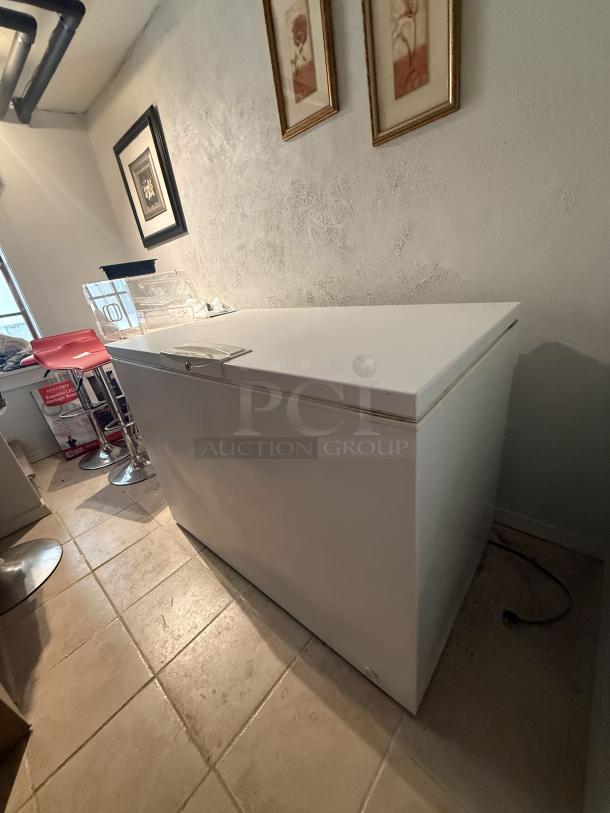 Kenmore 48" chest freezer, model 253.91935312. Clean, top-opening design with wire basket, locking mechanism, ideal for businesses.