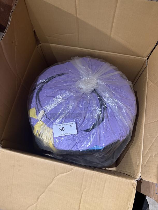 Skyer purple air dancer and blower set in a cardboard box. Appears new and packaged with label indicating "QTY 30" from PCBAuctions.com.