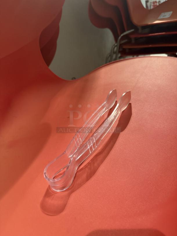 Clear plastic mini serving tongs, durable and lightweight, ideal for appetizers. Set of 10, perfect for events or everyday use.